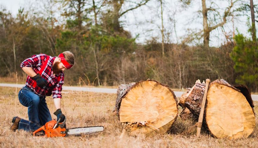 man using a chainsaw