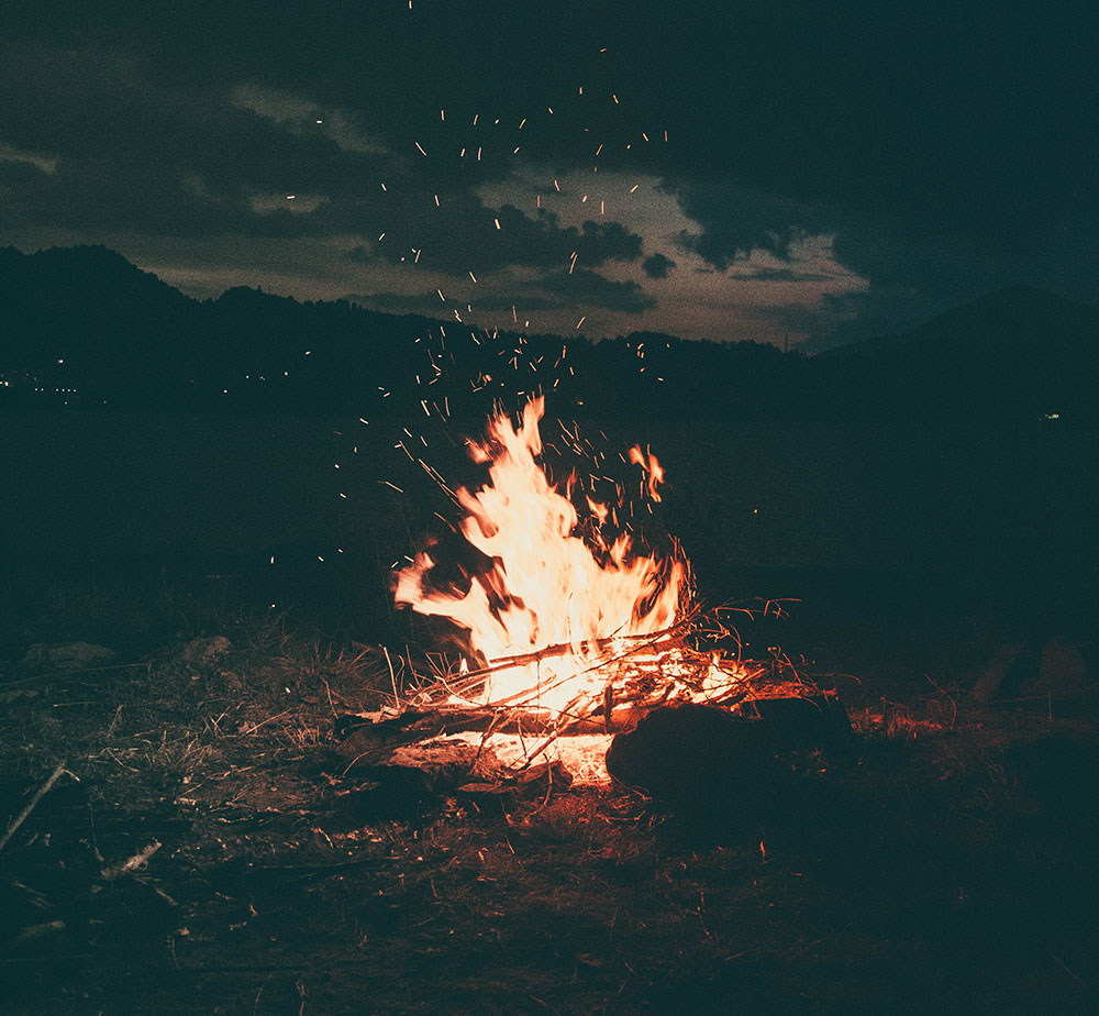 An outdoor bonfire in the dark