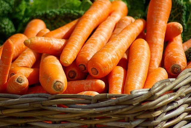 a basket filled with carrots