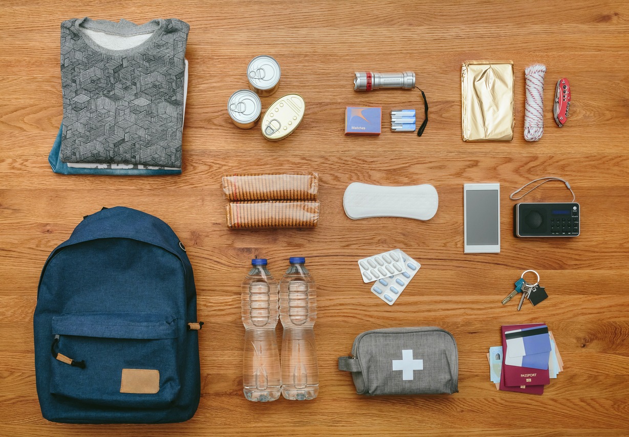 Top view of emergency backpack set with necessities